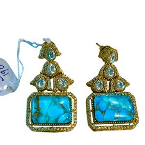 Gold-plated earrings featuring turquoise stones and cubic zirconia